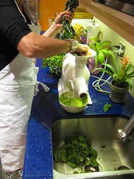 juicing vegetables in Coda Health Kitchen